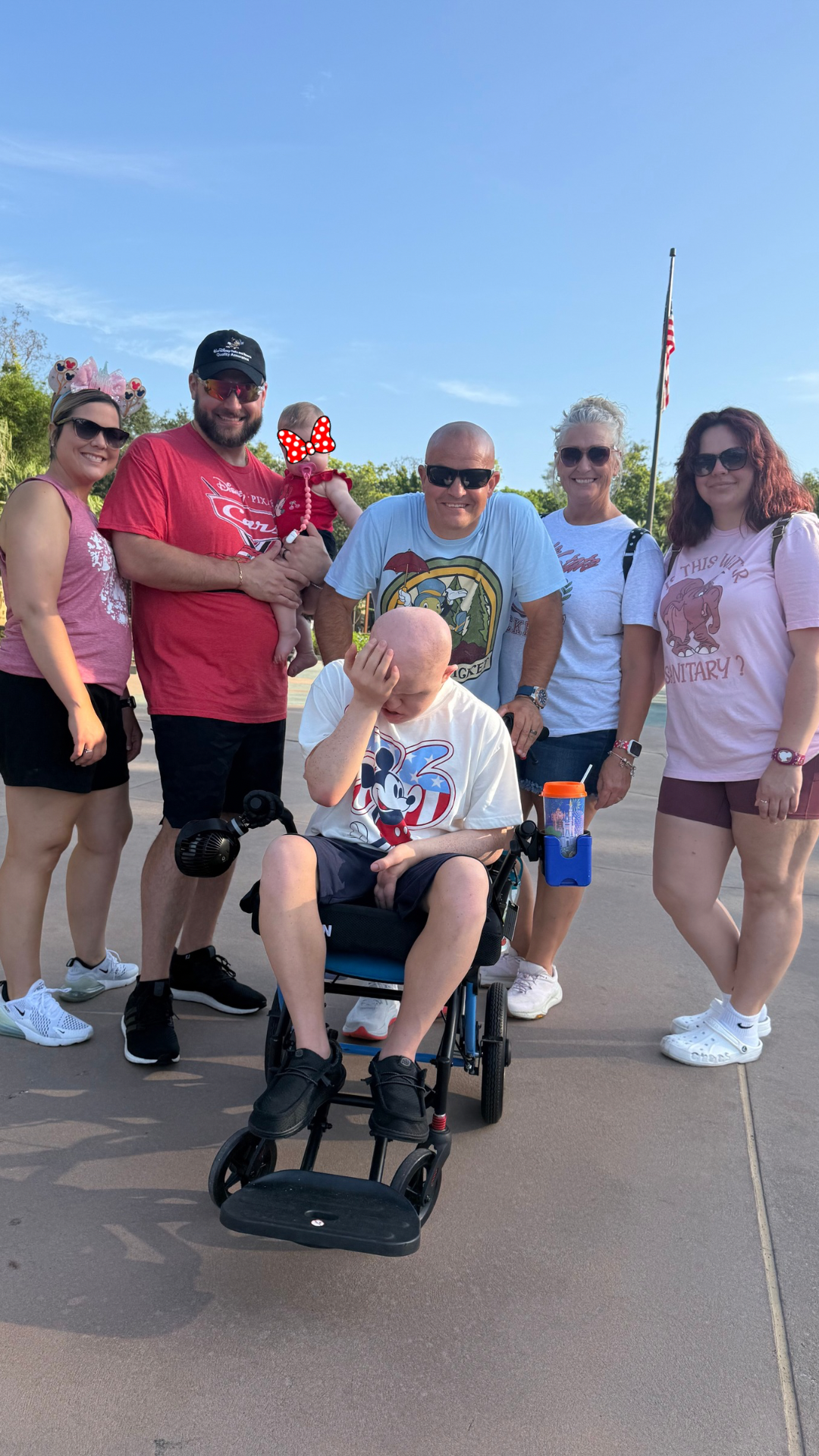 Pixie Packed Family together during a Disney park day, wearing the different shoes that work for each member of the family.