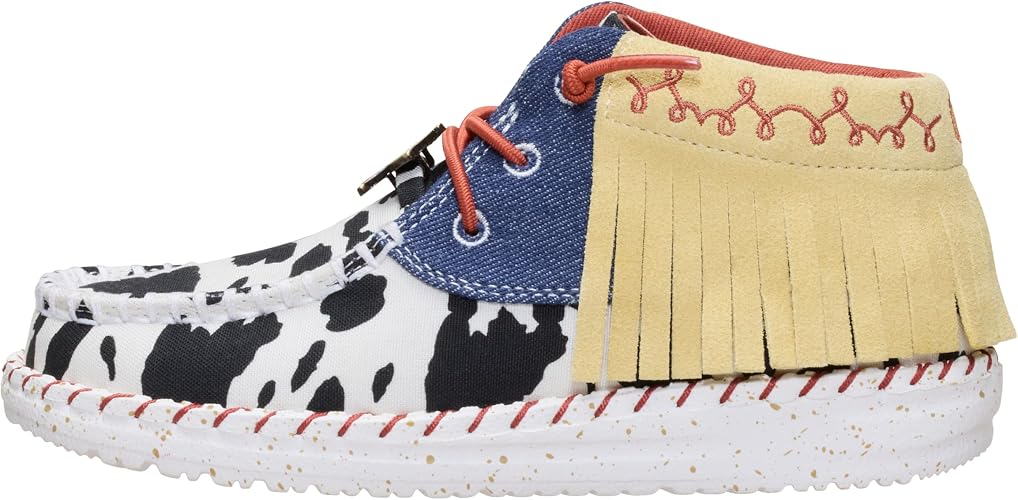Signature cowprint and denim upper, with suede mid fringe collar, delivers standout Jessie inspired style